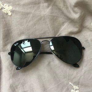 brand new pair of black Ray Ban sunglasses